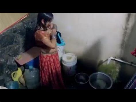 Desi village MILF nude bath hidden cam capture